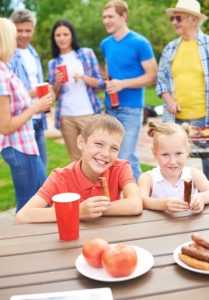 kids enjoying company picnic with their family because of children's entertainers