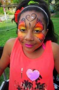 child with butterfly face painting from professional face painter