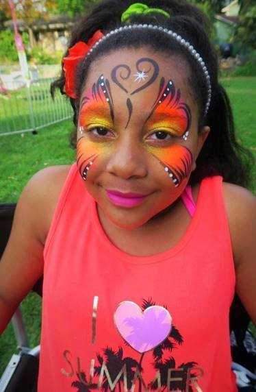 child with butterfly face painting from professional face painter