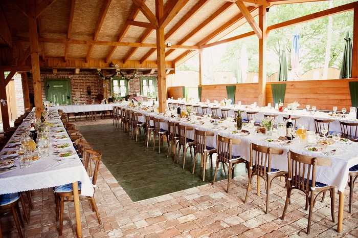 tables at summer wedding decorated and ready for guests