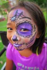 child with spider face painting